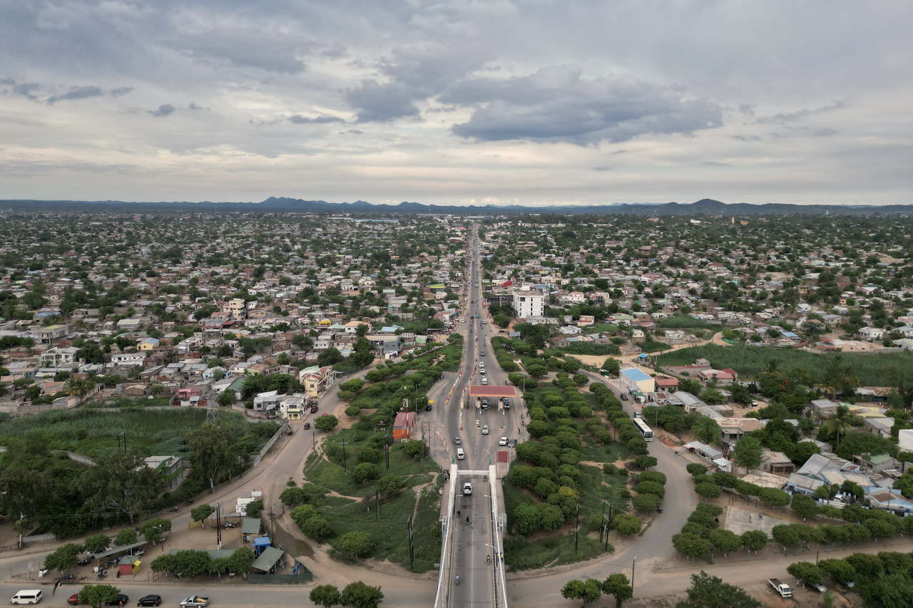 Aerial view of a Malawian cityscape with a highway running through it